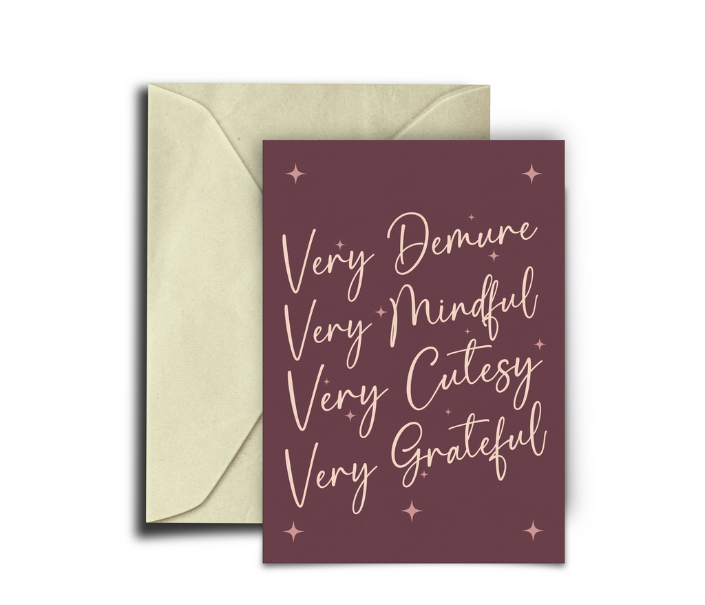 Card with text 'Very Demure Very Mindful Very Cutesy Very Grateful' on a purple background with a beige envelope.